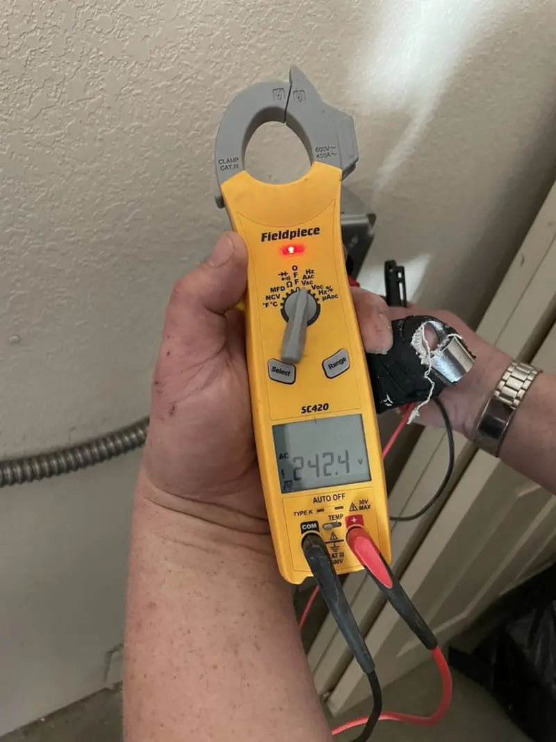 Voltage testing with clamp meter during Recessed Lighting Installation in Southgate